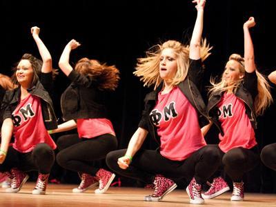 Members of Phi Mu perform Thursday at the annual Panhellenic Council step show at the River Center.