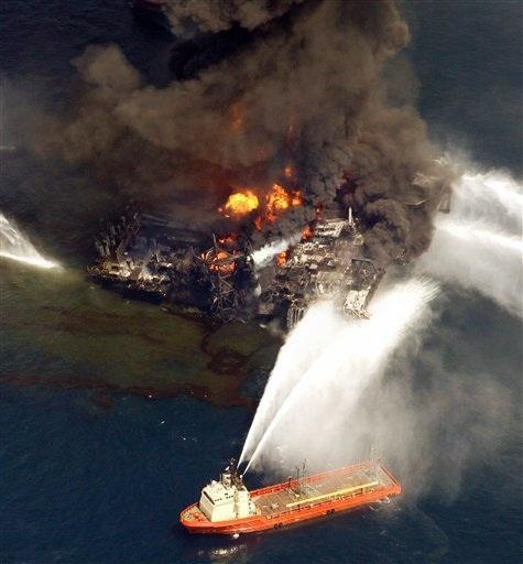 In this aerial photo taken in the Gulf of Mexico more than 50 miles southeast of Venice on Louisiana's tip, the Deepwater Horizon oil rig is seen burning Wednesday, April 21, 2010.