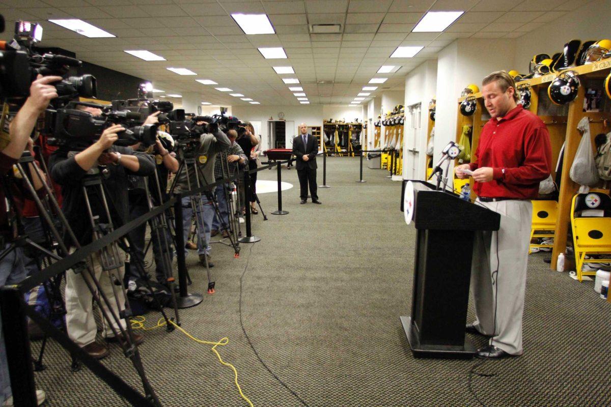 Steelers quarterback Ben Roethlisberger reads a statement Monday in the NFL football team&#8217;s locker room. He said he is &#8220;happy&#8221; to put sexual assault allegations in Georgia behind him and knows he must work to regain the trust of teammates and fans.