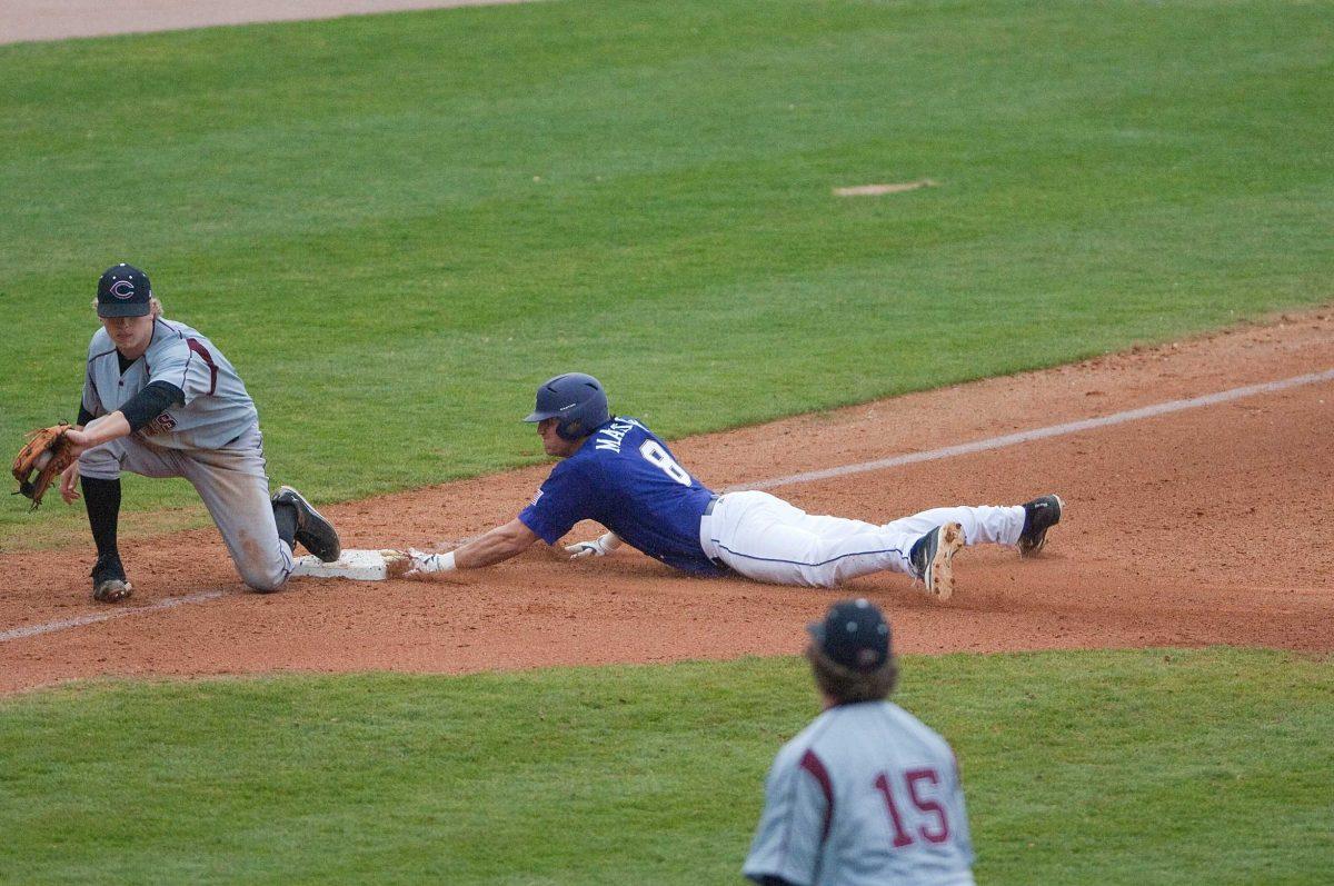 LSU sophomore outfielder Mikie Mahtook slides to third base on a wild pitch Feb. 21 during the Tigers&#8217; 4-0 win against Centenary at Alex Box Stadium.