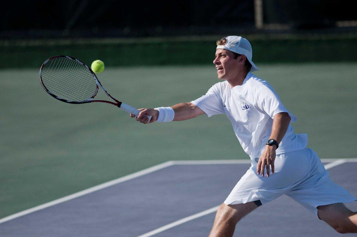 LSU sophomore Neal Skupski stretches for a forehand during the Tigers&#8217; victory Tuesday against South Florida that ended the Tigers&#8217; seven-match losing streak.