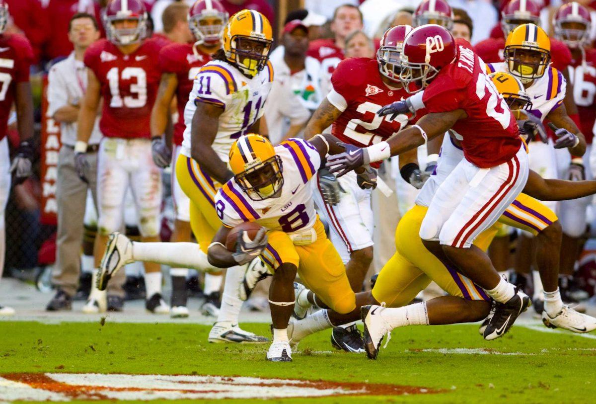 Former Tiger Trindon Holliday breaks free from tackles as he sprints across the field in LSU&#8217;s 15-24 loss to Alabama in Tuscaloosa, Ala., on Nov. 7.