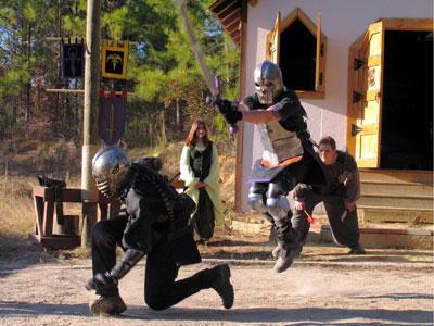 Sir Jason, right, pounces on a disoriented Squire Isenberg. The knights and squires practice chivalry sport, a competitive fight.