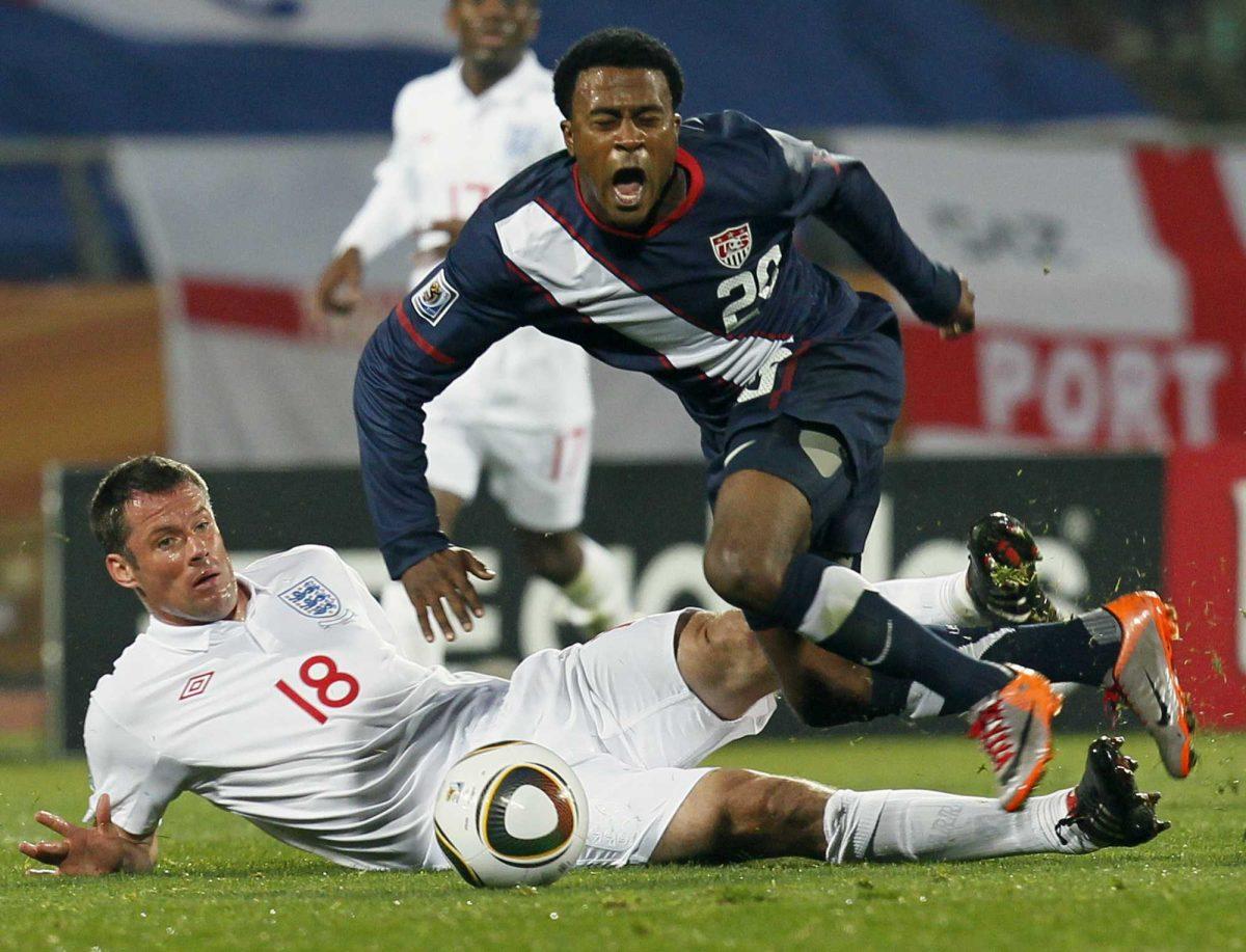 United States&#8217; Robbie Findley, right, is tackled by England&#8217;s Jamie Carragher, left, Saturday during the World Cup soccer match between England and the United States.