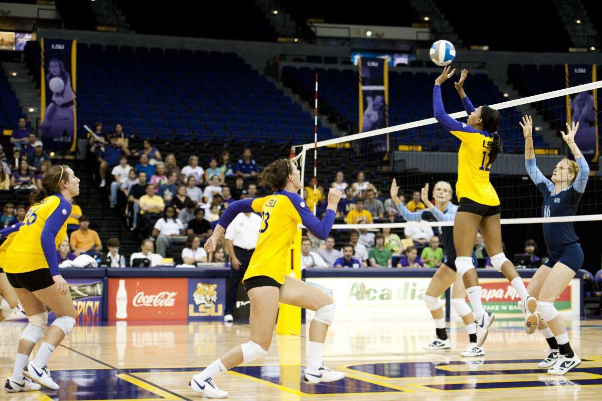 LSU senior setter Brittney Johnson (12) sets the ball for junior middle blocker Michele Williams (23) Sept. 10 during the Tigers&#8217; 3-0 win against North Carolina.