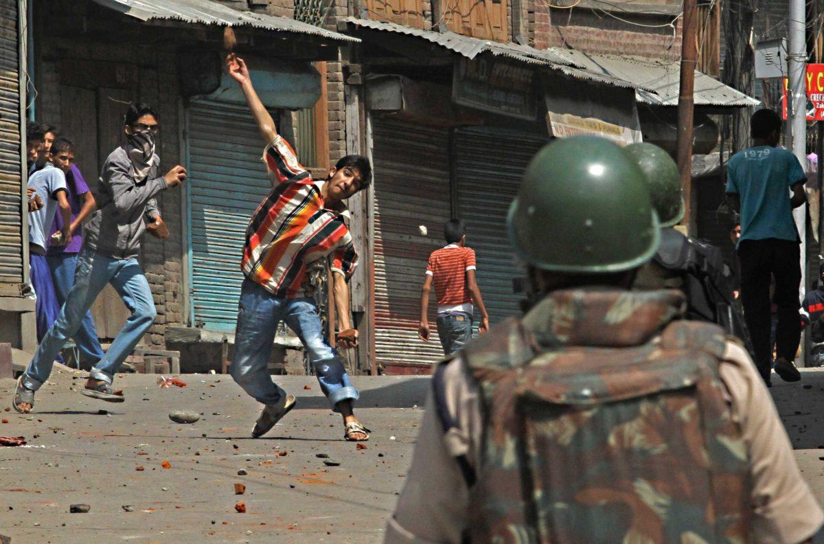 A Kashmiri Muslim protester throws stones and bricks at Indian police and paramilitary soldiers during a protest in Srinagar, India, Sept. 6.