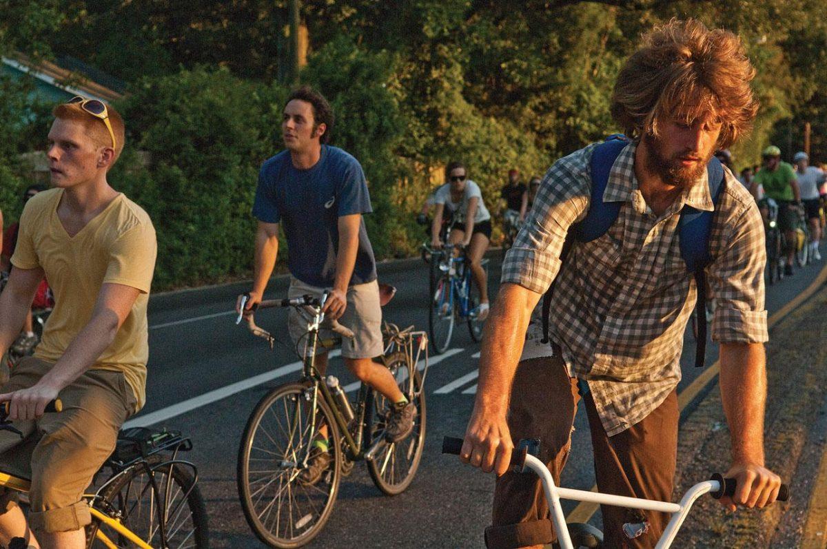 Critical Mass riders turn at a stop light on North Acadian on Friday to finish their ride to the state Capitol. Critical Mass is held the last Friday of every month.