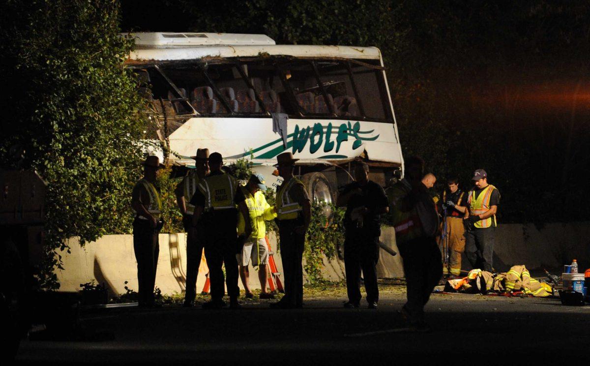 The scene of a bus crash on Interstate 270, Wednesday, Sept. 29, 2010, in Bethesda, Md., where a commuter bus plunged off the highway outside the nation's capital, killing one person and injuring at least a dozen, including children, authorities said.