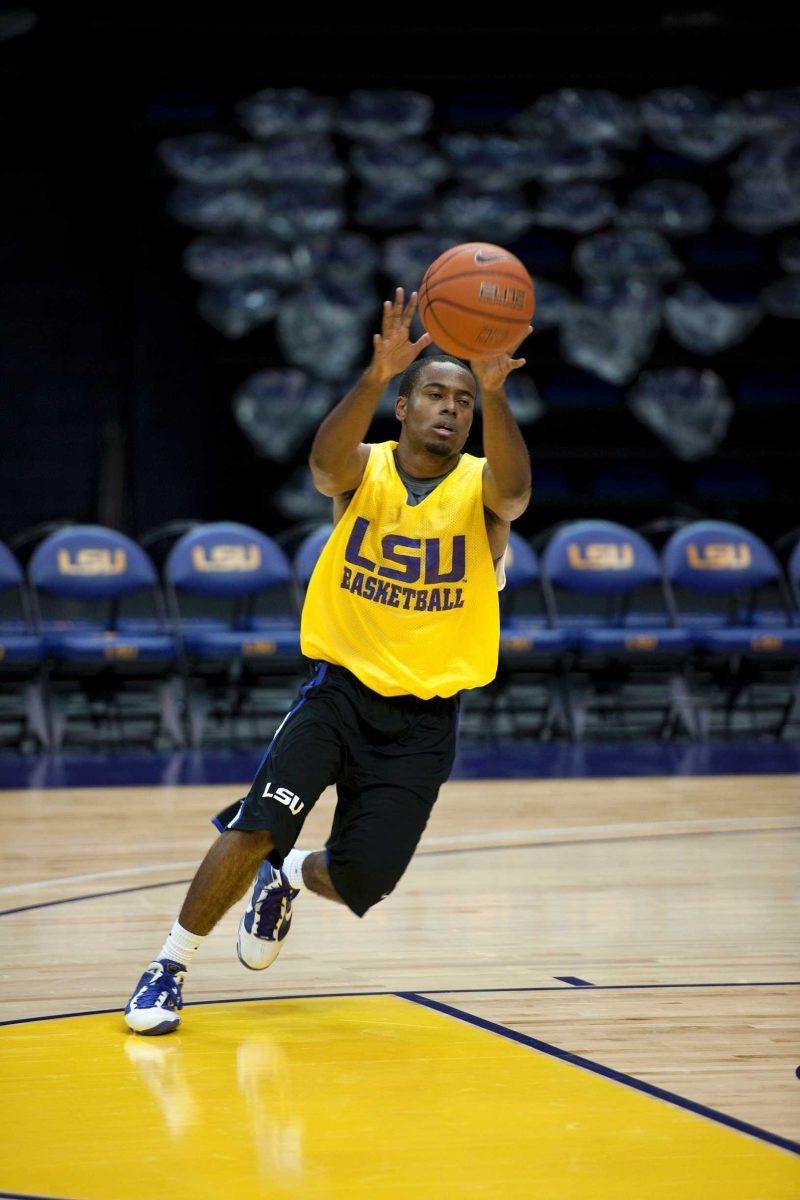 Sophomore guard Daron Populist passes the ball during walk-on tryouts Wednesday in the PMAC. Populist was a walk-on last season and was invited back to the team.