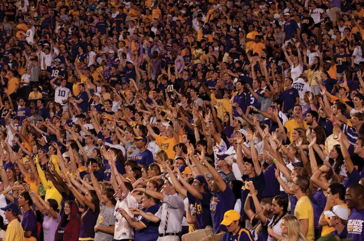 Fans in Tiger Stadium do the wave Saturday during LSU&#8217;s win against West Virginia.