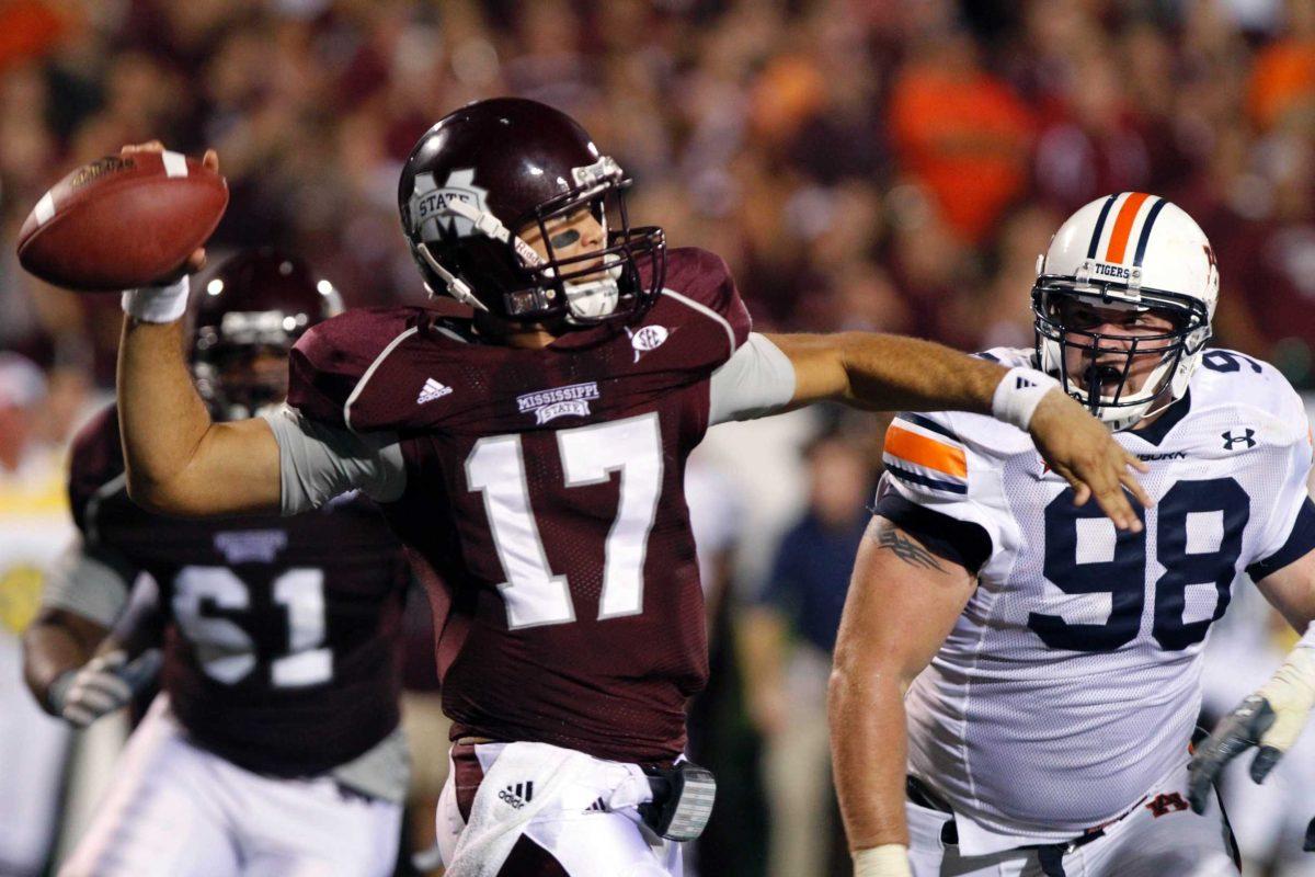 Mississippi State junior quarterback Tyler Russell (17) looks for receivers Sept. 9 as an Auburn defensive lineman rushes him during the Bulldogs&#8217; 17-14 loss.