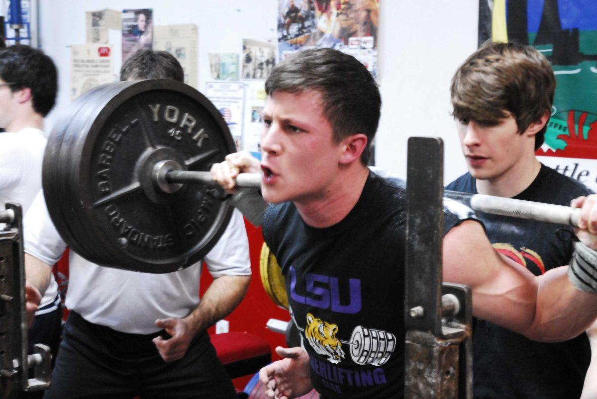 Reece Verbois, one of the three LSU powerlifting club members that competed with team USA at the Junior World Championships, prepares for a squat lift.