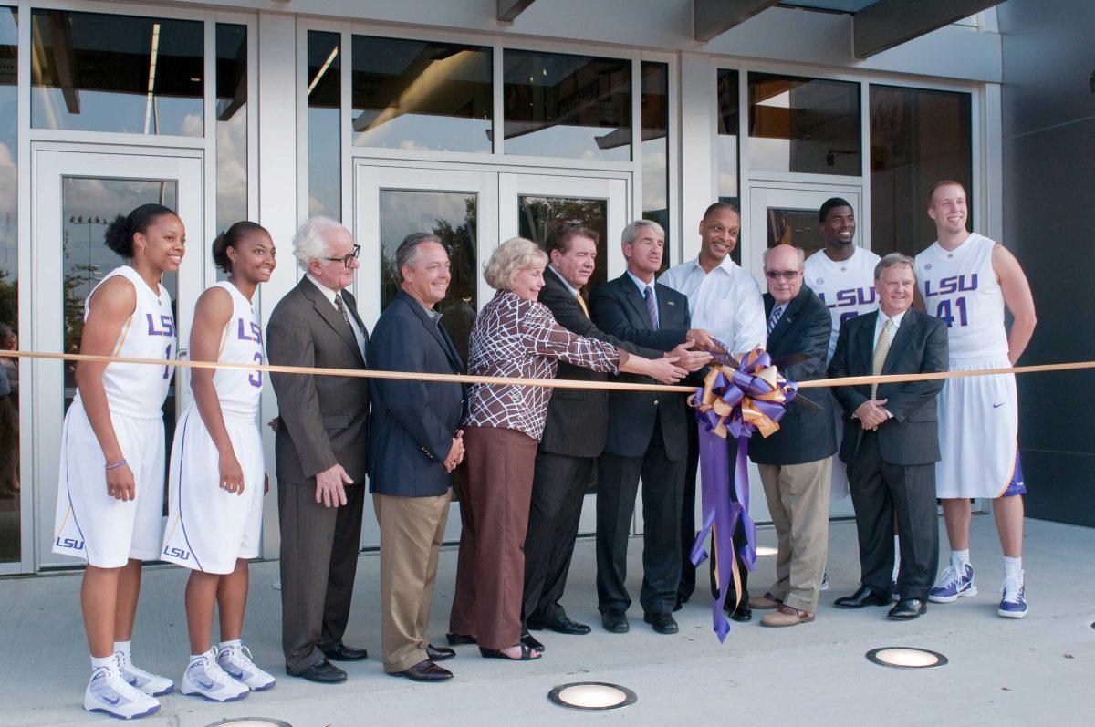 LSU women&#8217;s basketball coach Van Chancellor, Athletic Director Joe Alleva, men&#8217;s basketball coach Trent Johnson and Chancellor Michael Martin are joined Thursday by others during the grand opening of the PMAC basketball practice facility.