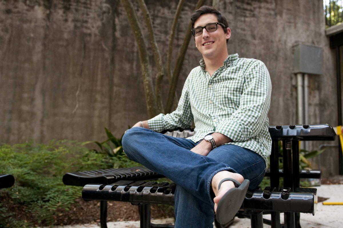 Martin Roth, international trade and finance senior, sits with a pair of Feelgoodz flip flops Thursday. Roth is the vice president of Feelgoodz.