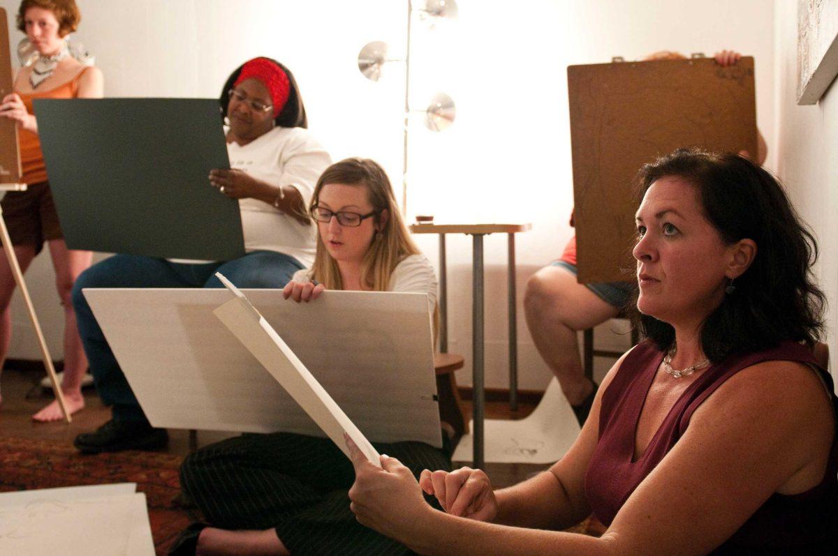 Juliet Lockwood glances at a model Wednesday during a figure drawing class she teaches at Look Studios and Gallery.