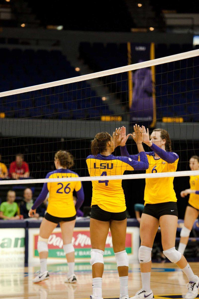 LSU freshman middle blocker Desiree Elliott (4) and sophomore outside hitter Madie Jones (6) celebrate Sept. 10 after winning a point during the Tigers&#8217; game against North Carolina. LSU beat the Tar Heels, 3-0, and remains undefeated this season.