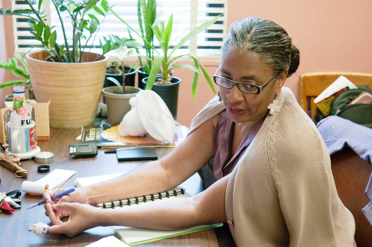 University English professor Brenda Obsey talks of her childhood in New Orleans on Wednesday afternoon in her office in Allen Hall. Osbey has had her poems published.