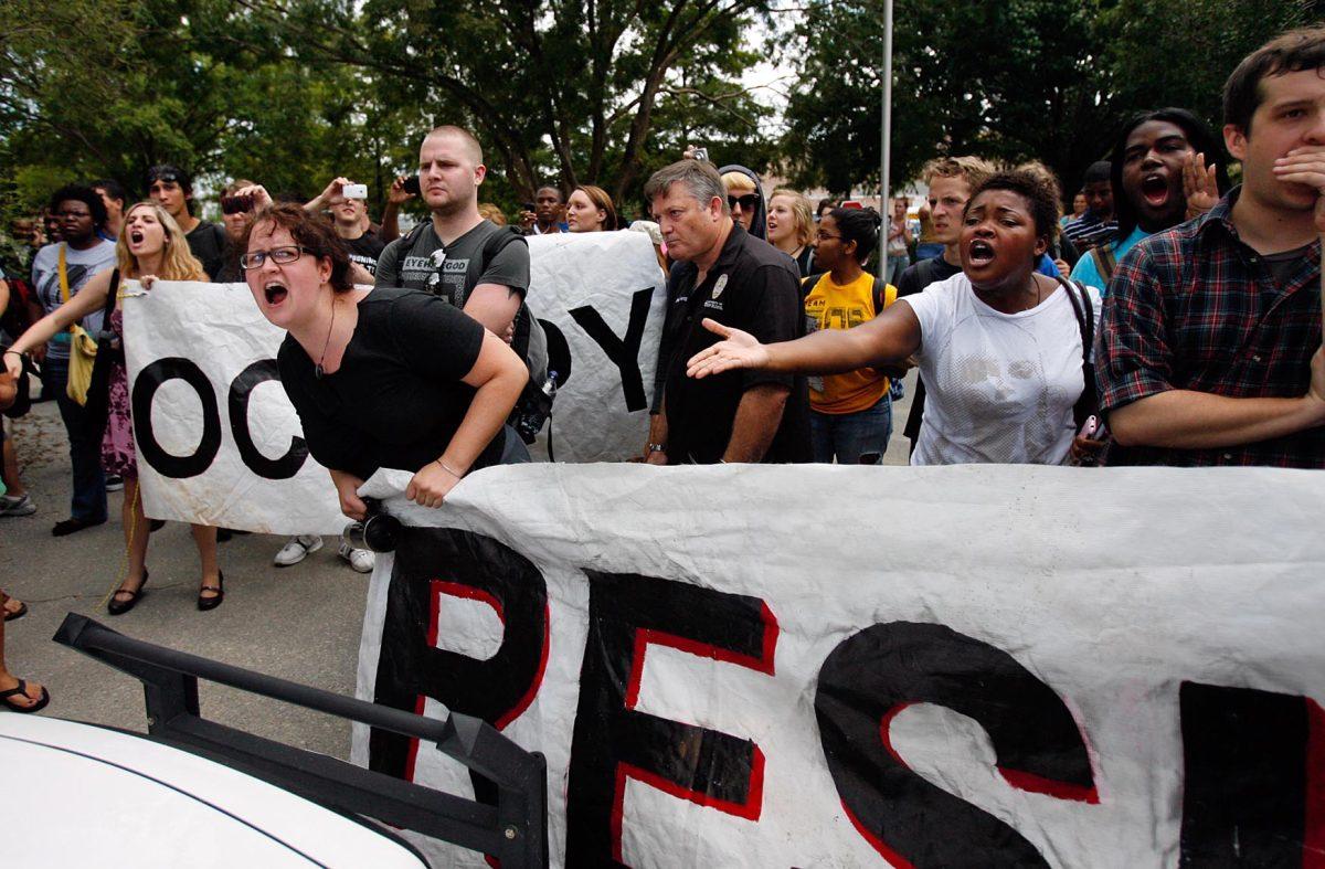 Demonstrators scream at UNO campus police Wednesday for detaining a student. LSU students, unlike UNO&#8217;s, have mostly remained indifferent to budget cuts.