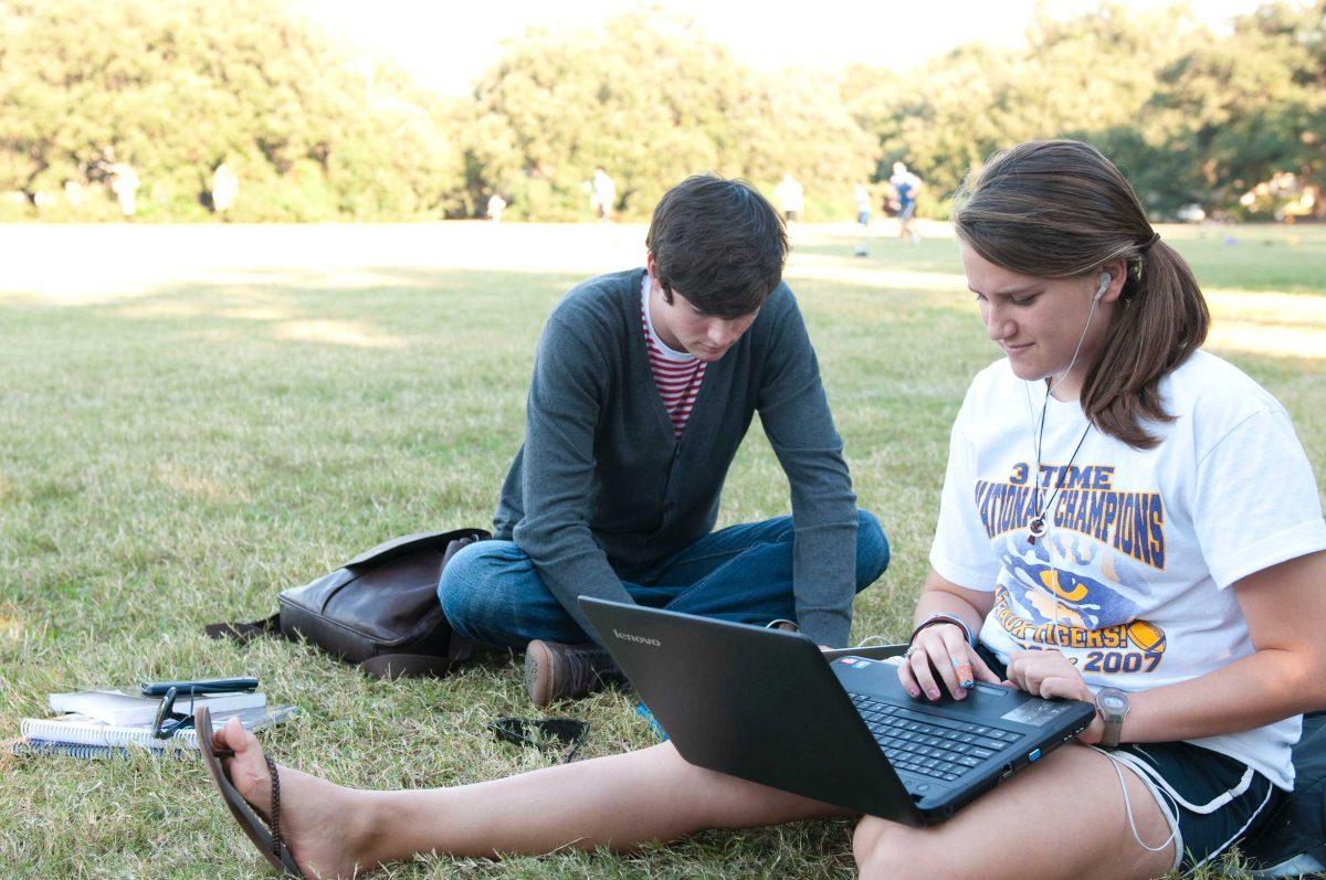 Animal science sophomore Megan Garrett and kinesiology sophomore Troy Brouillette relaxing in the cool weather Tuesday evening on the Parade Ground.