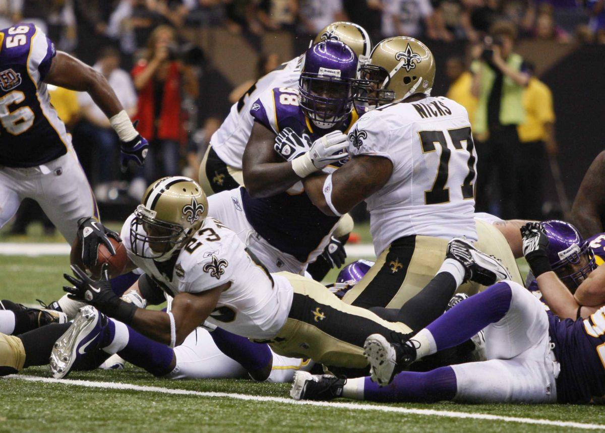 New Orleans Saints running back Pierre Thomas (23) scores the game winning touchdown against the Minnesota Vikings during the season opening NFL game in New Orleans on Thursday, Sept. 9. The Saints won, 14-9.