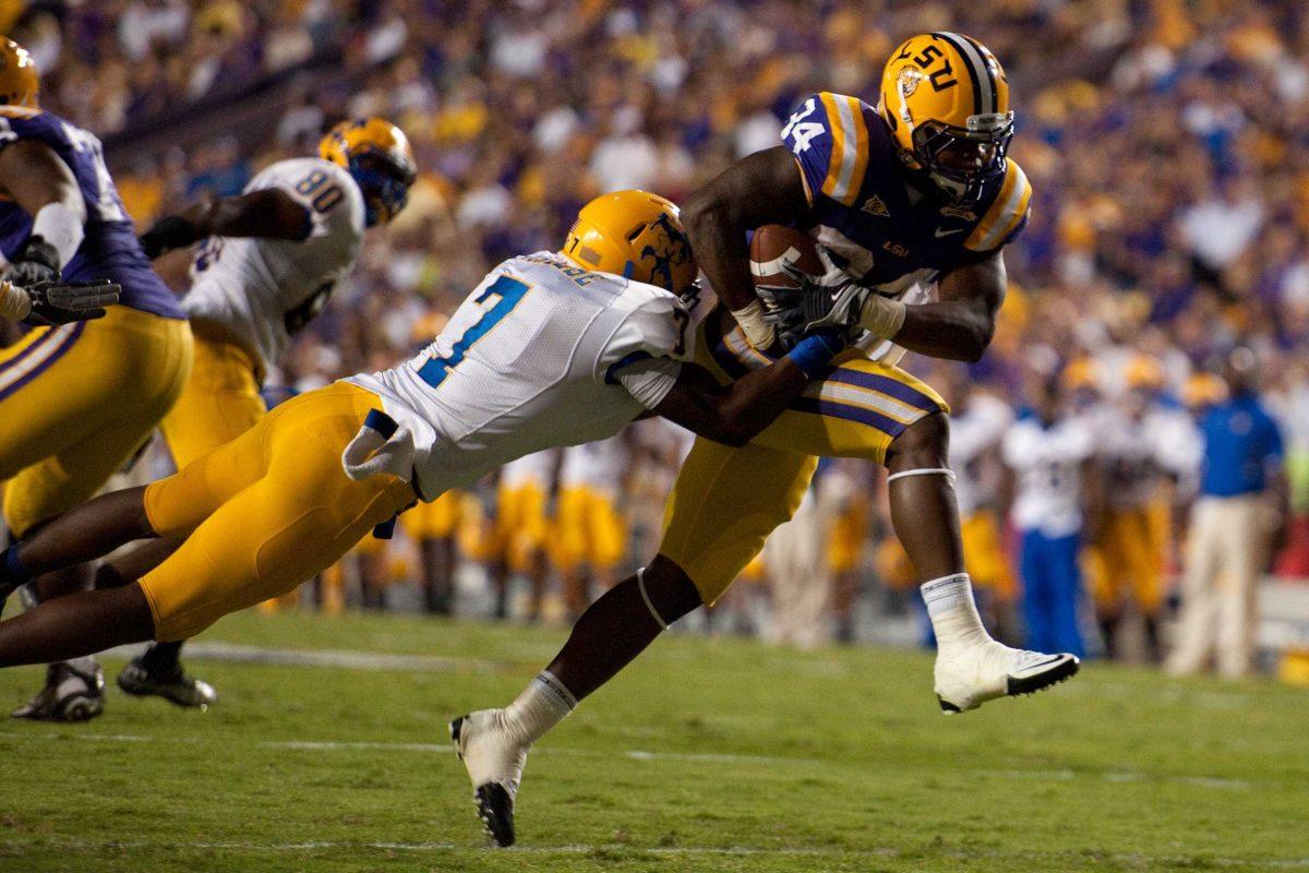 LSU junior running back Stevan Ridley (34) runs for a first down Saturday during the Tigers&#8217; 32-10 victory against the McNeese State Cowboys in Tiger Stadium.