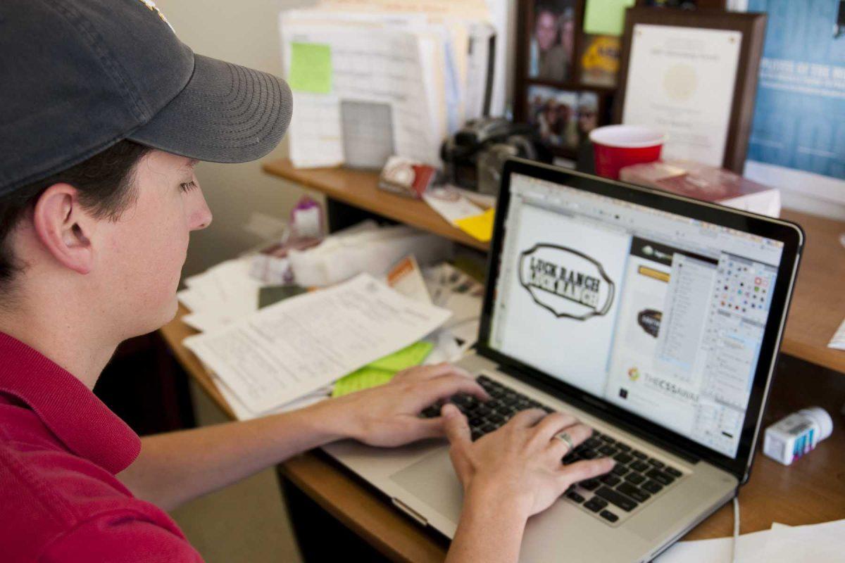 Trey Bartsch, Red Six Media creative director, works on an advertisement for a client.