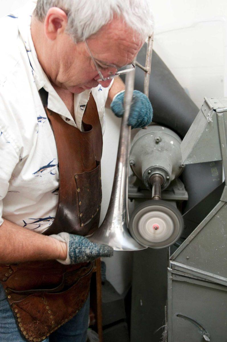 LSU Department of Bands instrument repair technician Mark Vandermark polishes a donated trombone dating to 1917. The instrument originally belonged to the donor&#8217;s father who played in Tiger Band during his time as a student at LSU.