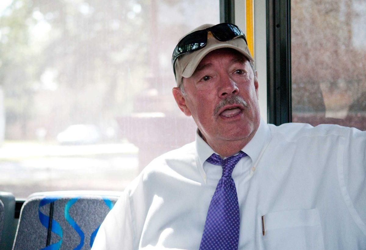 Chancellor Michael Martin joins students Monday to discuss campus issues on one of the Highland-Ben Hur Tiger Trails buses as part of Chats with the Chancellor.