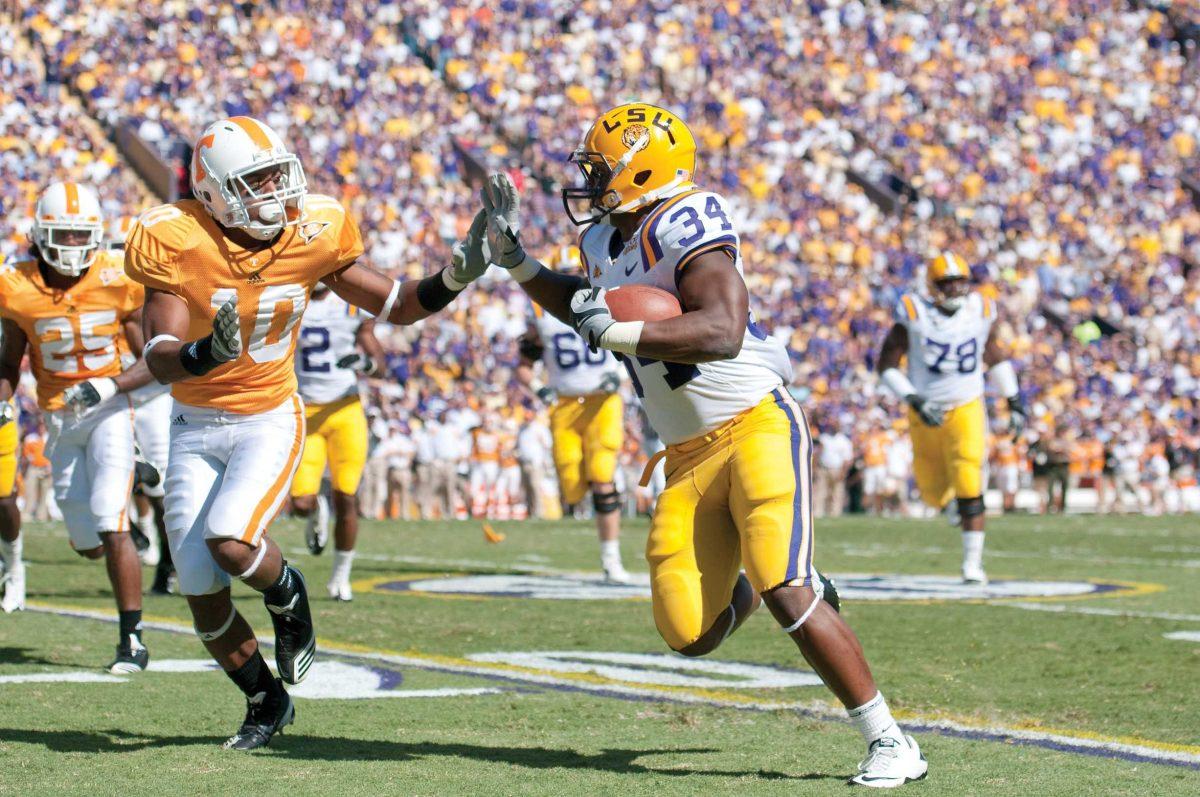 LSU junior running back Stevan Ridley (34) fends off Tennessee sophomore defensive back Marsalis Teague (10) on Oct. 2 during the Tigers&#8217; 16-14 win against the Volunteers in Tiger Stadium. Ridley has rushed for 640 yards and four touchdowns this season, ranking him second in the Southeastern Conference.