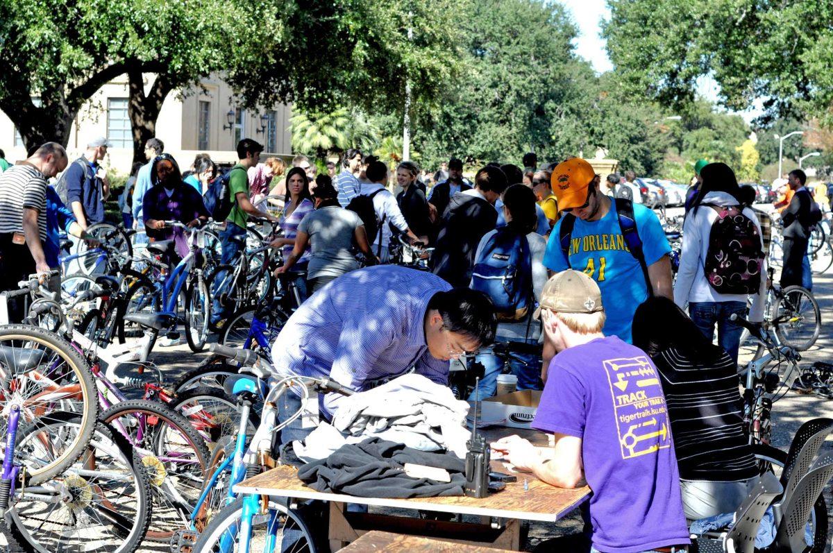 Students gather Tuesday for the annual Student Government bike auction held in front of Memorial Tower. About 300 abandoned bikes were up for auction.