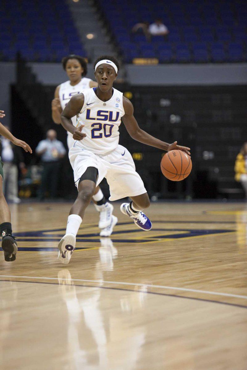 Junior guard Destini Hughes (20) dribbles the ball during the Lady Tigers&#8217; 67-47 exhibition win Nov. 8 against the Delta State Fighting Okra in the PMAC.