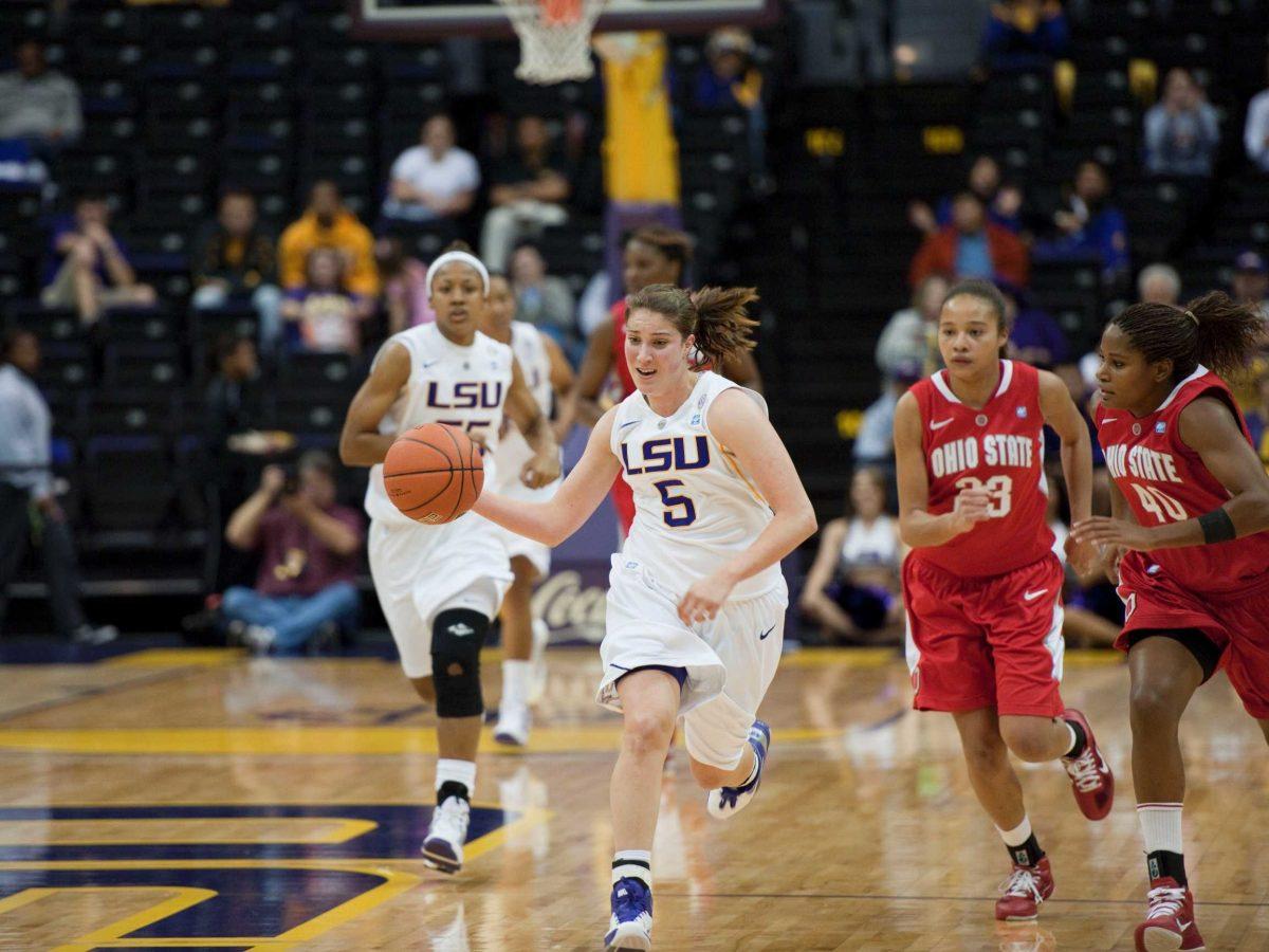 LSU freshman guard Jeanne Kenney (5) dribbles down court Wednesday away from Ohio freshman forward Martina Ellerbe during the Lady Tigers&#8217; 59-55 loss in the PMAC.