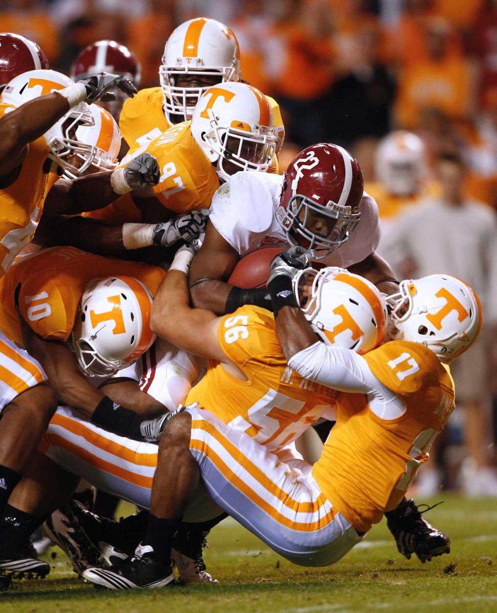 Alabama running back Mark Ingram (22) is tackled by Tennessee&#8217;s Nick Reveiz (56), Brent Brewer (17) and others Oct. 23 during Alabama&#8217;s 41-10 win. LSU is preparing to take on Alabama on Saturday.