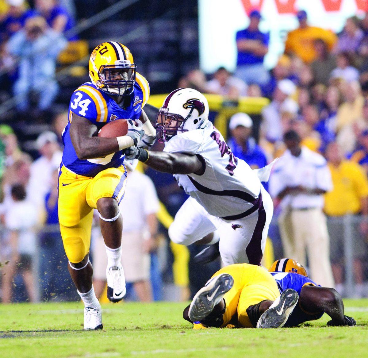 LSU junior running back Stevan Ridley breaks a tackle Saturday during LSU&#8217;s 51-0 win against Louisiana-Monroe. Ridley ran for 67 yards and two touchdowns.