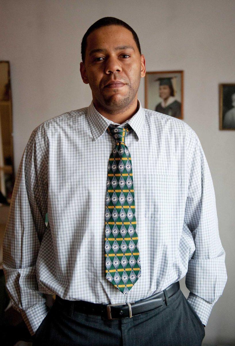 In this Jan. 24, 2011 photo, John Stone of Chicago wears a Green Bay Packers tie. Stone was fired from his job as a car salesman at an Oak Lawn, Ill. dealership Monday after refusing to remove the tie after the Packers beat the Chicago Bears in the NFC Championship game. He said he wore the tie to honor his late grandmother, who was a big Green Bay fan. His boss said Stone was offered five chances to take off the tie and refused to do it.