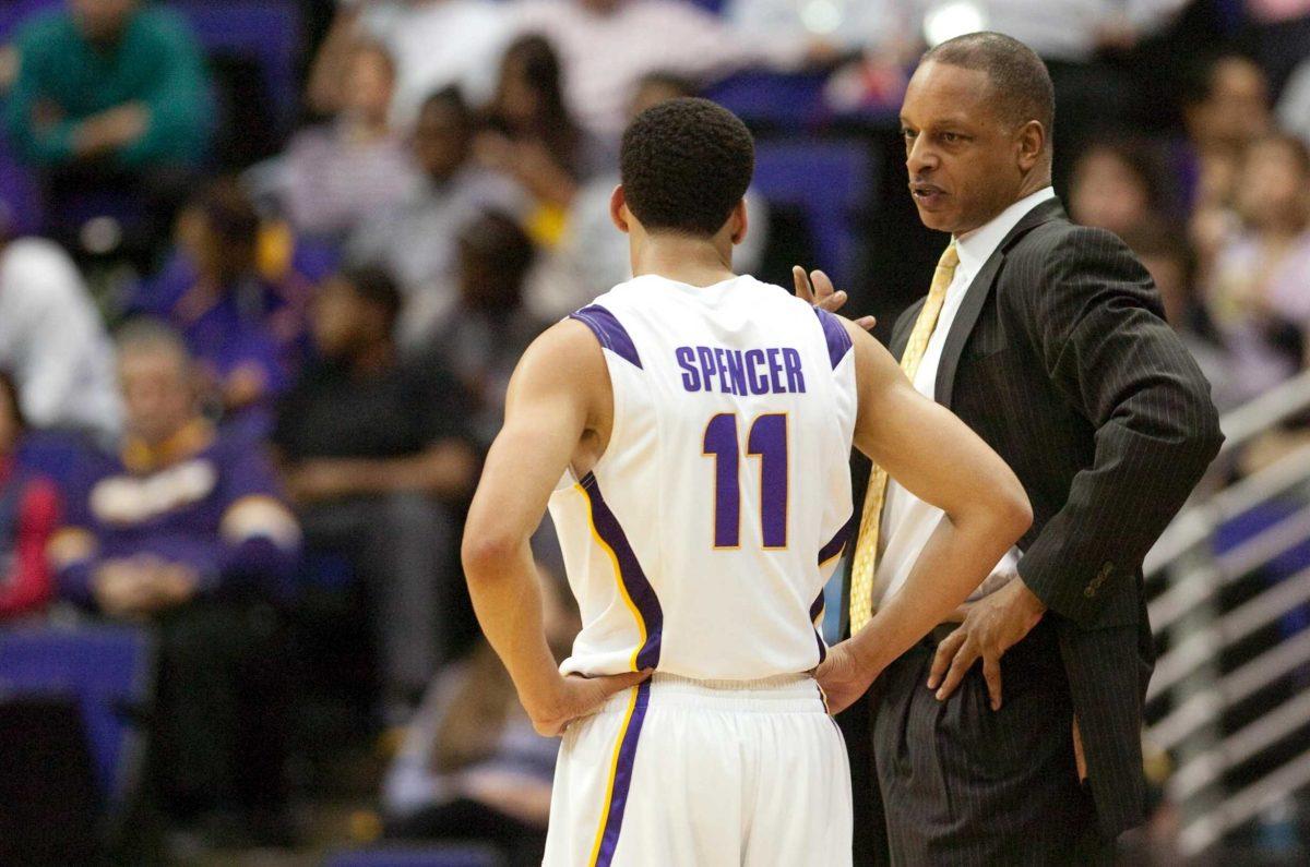 LSU men&#8217;s basketball coach Trent Johnson talks with former LSU guard Bo Spencer in the Tigers&#8217; 77-60 win against Southeastern Louisiana on December 14, 2009.