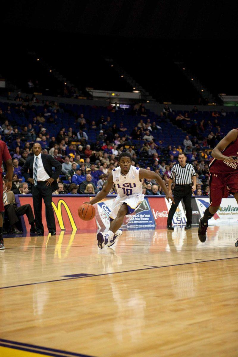 LSU freshman guard Andre Stringer drives down the court Wednesday during the Tigers&#8217; 64-56 loss against South Carolina in the PMAC. Stringer scored 19 points.