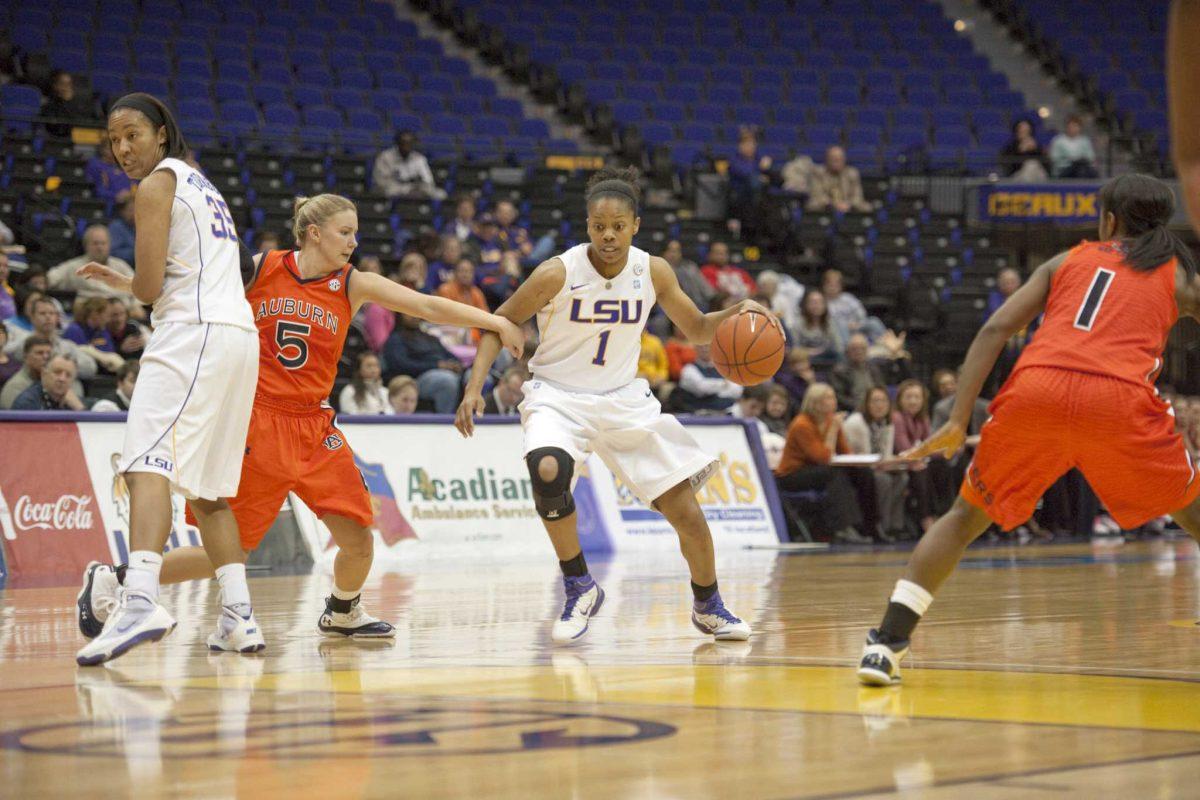 Senior guard Katherine Graham dribbles past an Auburn defender Feb. 10 in LSU&#8217;s 55-52 win. The Lady Tigers finish their regular season home slate against South Carolina.