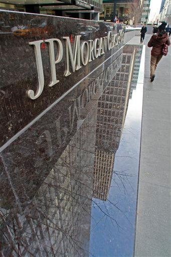 A part of the JP Morgan Chase building reflects in its granite sign wall on Friday, Feb. 4, 2011 in New York. E-mails and other internal documents show that executives at JPMorgan Chase were complicit in Bernard Madoff's massive fraud, lawyers seeking to recover funds for his victims said Thursday.