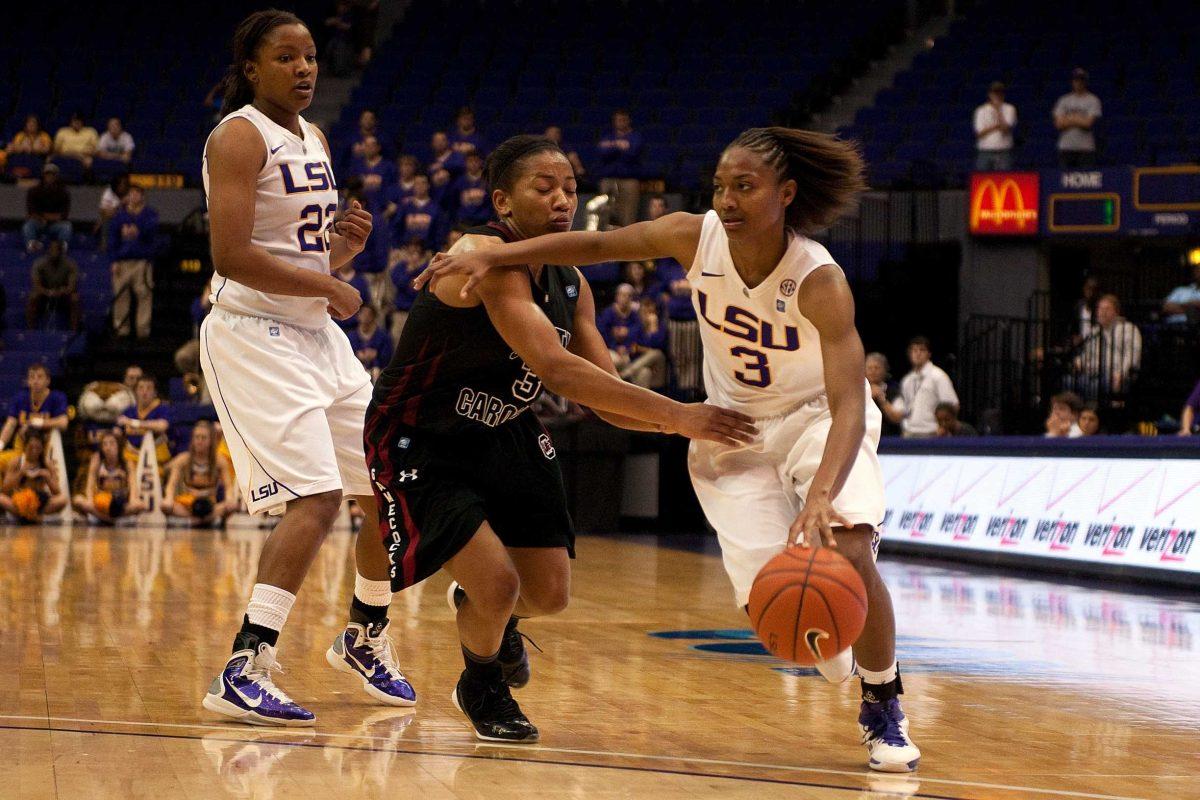 LSU senior guard Latear Eason (3) dribbles past a South Carolina defender Thursday during the Tigers&#8217; 54-51 victory against the Gamecocks in the PMAC.