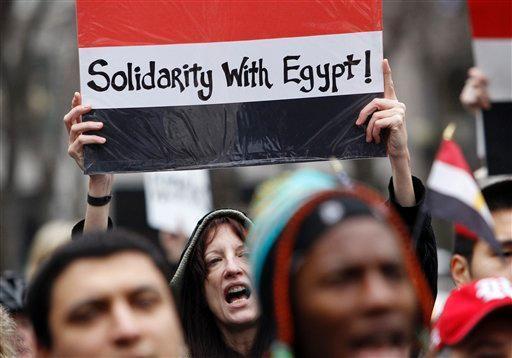 A protester chants during a demonstration in support of ousting Egyptian President Hosni Mubarak, Saturday, Feb. 5, 2011, in Seattle. Several hundred people protested for nearly two hours, calling for solidarity with demonstrators in Egypt and a change in the regime there.