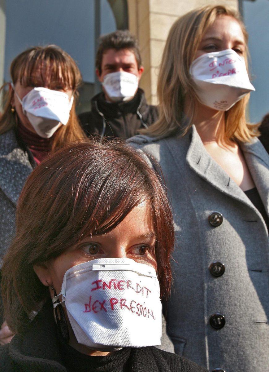 A lawyer wearing a mask reading &#8220;Forbidden of Expression&#8221;, demonstrate alongside judges Thursday in front of the Justice Palace in Nice, France, during a national protest.