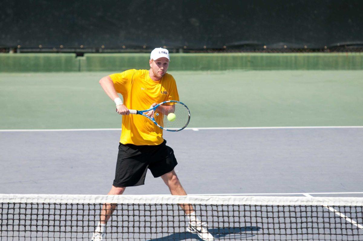 LSU senior Sebastian Carlsson backhands a return Tuesday in LSU&#8217;s 4-3 win against Nebraska. Carlsson is still rehabbing an injured wrist but will play this weekend.