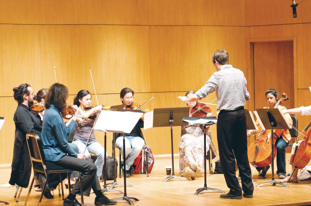 The Louisiana Sinfonietta orchestra rehearses Wednesday evening for the Festival of Contemporary Music in the School of Music Recital Hall. The concert will feature works composed by University graduate students.