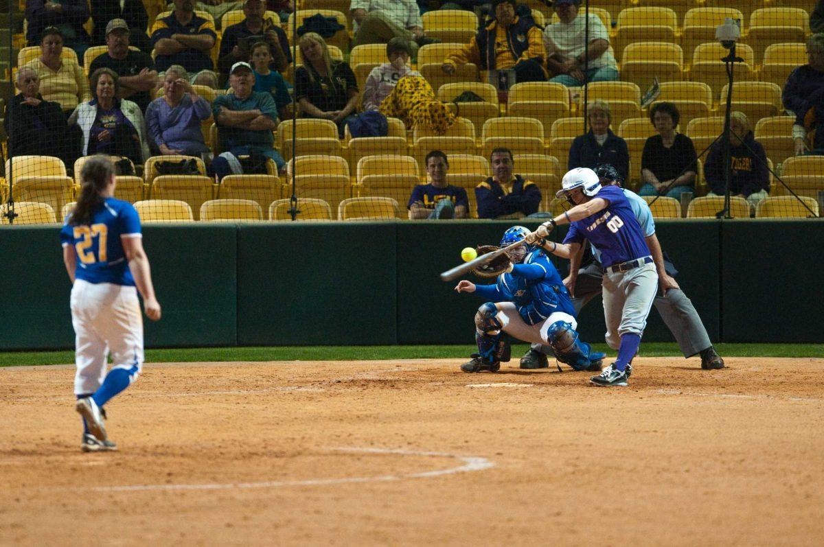 LSU junior outfielder Ashley Langoni (00) connects with a pitch during the Feb. 23 game against McNeese. The Tigers went on to win 7-1.