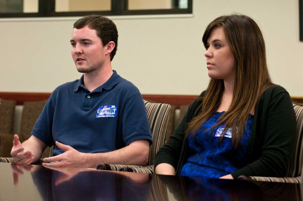 Student Government presidential candidate Cody Wells, left, and vice presidential candidate Kathleen Bordelon discuss their campaign Wednesday in Hodges Hall.