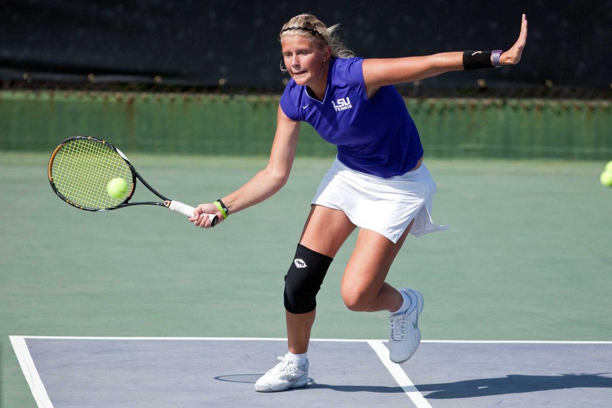 LSU freshman Yvette Vlaar returns a serve Wednesday during a doubles match against Colorado at W.T. &#8220;Dub&#8221; Robinson Stadium. The Lady Tigers won, 6-0.