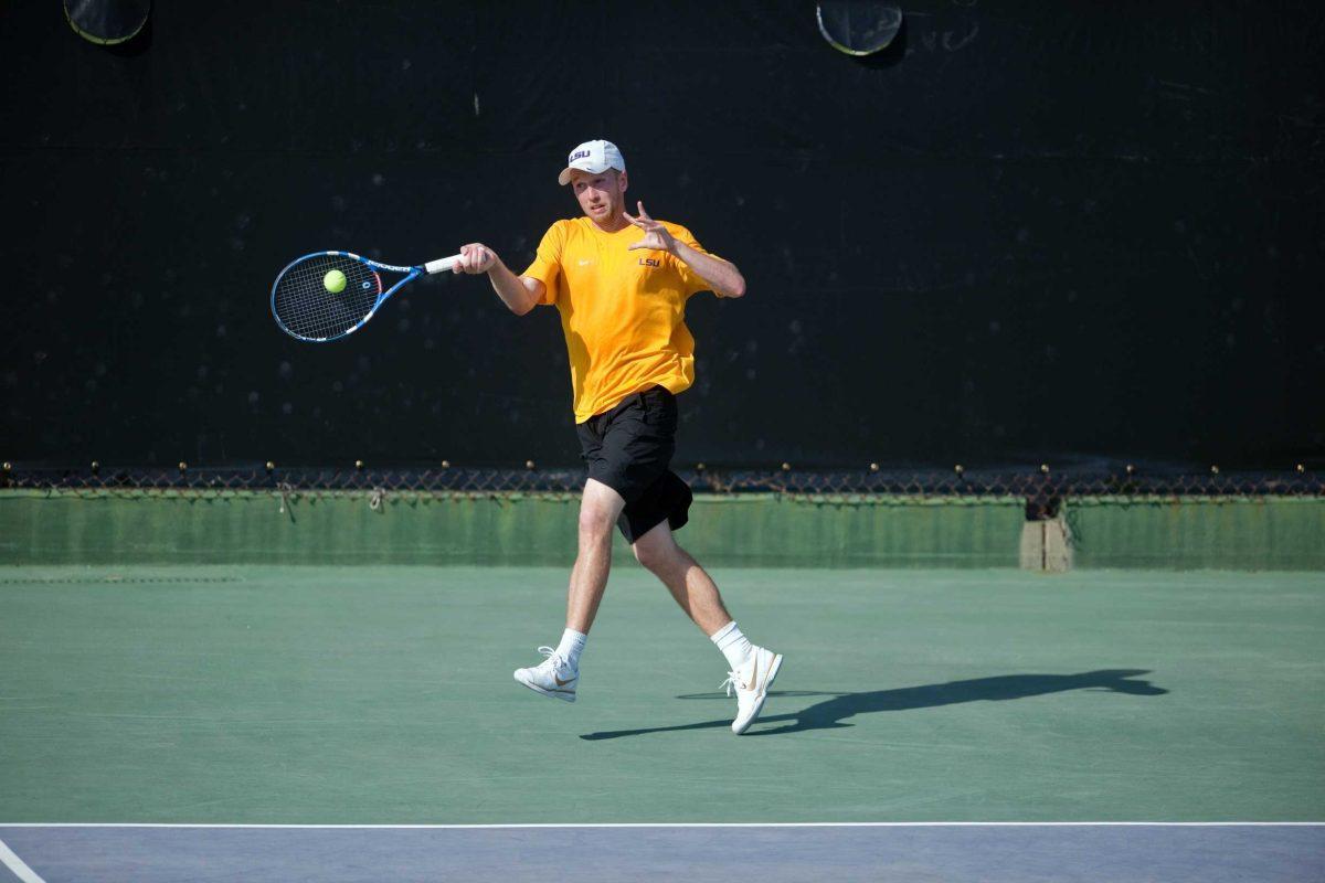 LSU senior Sebastian Carlsson smashes a forehand during a match Wednesday against Virginia at W.T. &#8216;Dub&#8217; Robinson Stadium. Carlsson won 1-6, 6-5, 1-0.