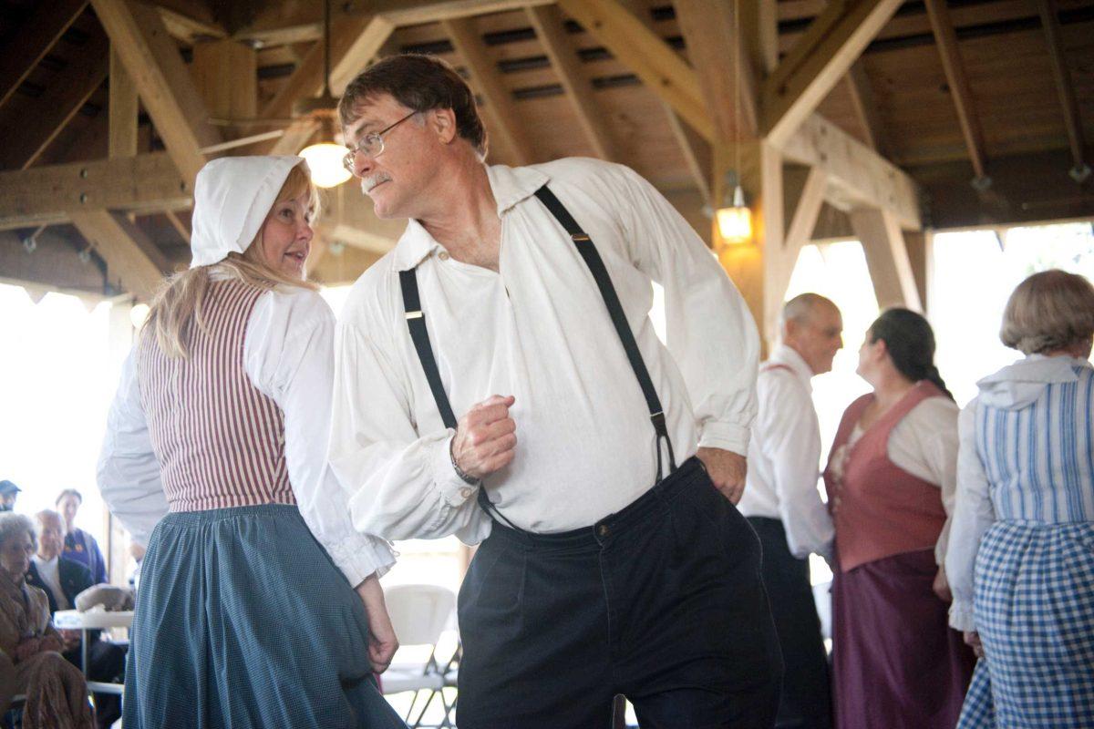 Renaissance Cadienne dance group president Harry Leonard participates in a traditional Cajun dance. The event showcased Cajun heritage and culture.