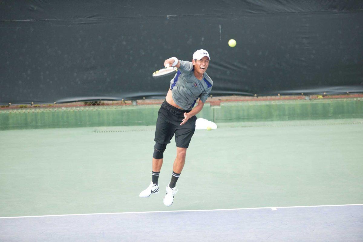 LSU sophomore Stefan Szacinski serves a ball Thursday against No. 16 Michigan in LSU&#8217;s 5-2 win. Szacinski won a singles match against Michigan&#8217;s Shaun Bernstein.